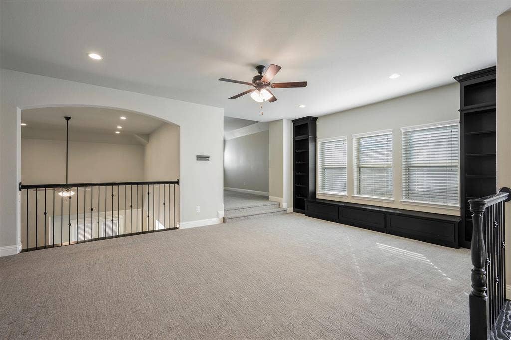 941 Leola Lane, Allen, TX 75013 Carpeted loft area featuring a ceiling fan, recessed lighting, and built-in shelving with window seating