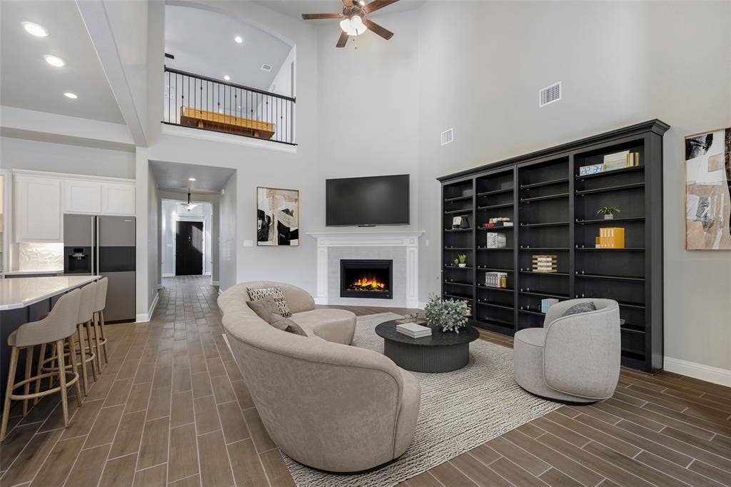 941 Leola Lane, Allen, TX 75013 Vaulted ceilings, wood-finish tile flooring, and an integrated fireplace
