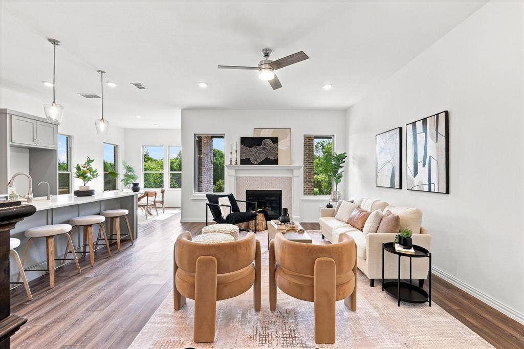 3109 Taunton Way, McKinney, TX 75069 Open concept living space with wood-finish flooring, a contemporary fireplace, and recessed lighting