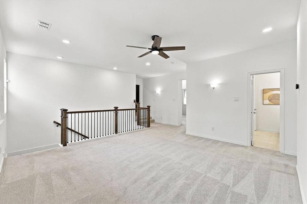 3109 Taunton Way, McKinney, TX 75069 Expansive carpeted area featuring a ceiling fan, recessed lighting, and sconce light fixtures
