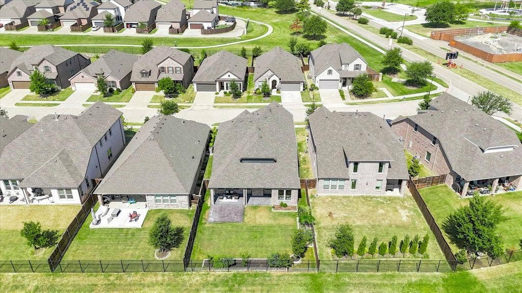 3109 Taunton Way, McKinney, TX 75069 Expansive green spaces and multiple properties featuring covered patios