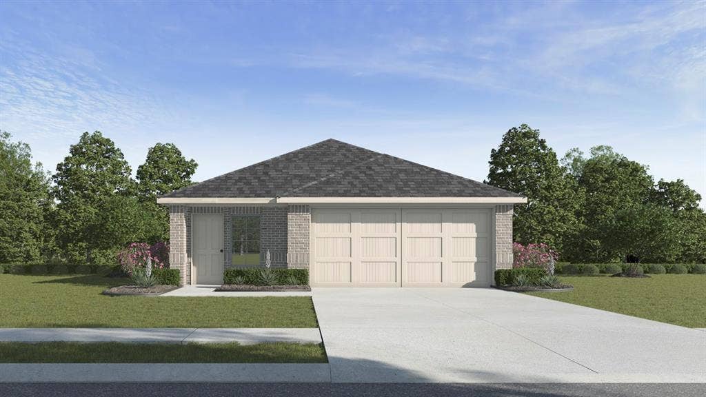 Single-story residence featuring a brick facade, attached two-car garage, and a concrete driveway