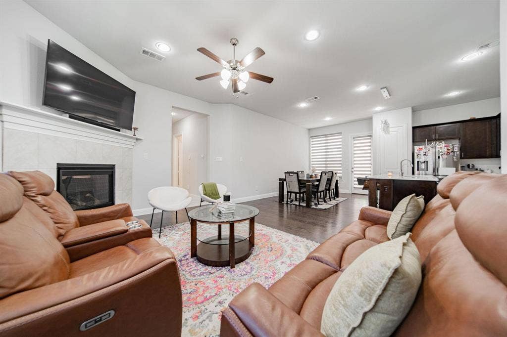 Hardwood-style flooring, recessed lighting, and a ceiling fan