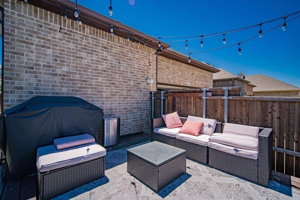 Brick exterior wall with integrated string lighting