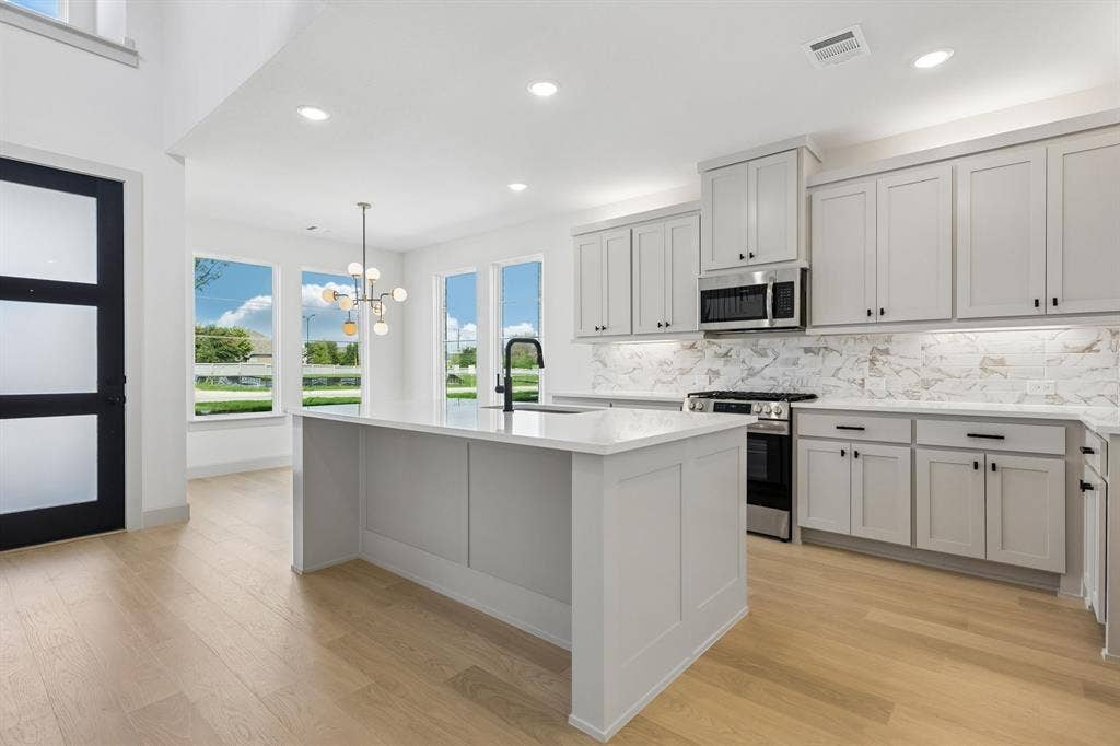 3716 Malamute Run, McKinney, TX 75071 Open and light filled, this dream kitchen is the perfect place to host family and friends.