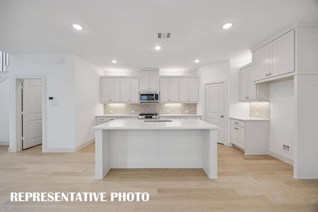 3737 Homer Court, McKinney, TX 75071 The large kitchen island is the hub of your new dream kitchen! REPRESENTATIVE PHOTO