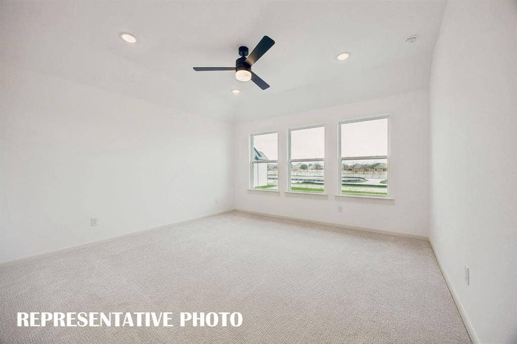 3737 Homer Court, McKinney, TX 75071 High ceilings, plush carpeting, a wall of windows and luxurious en suite bath create an owner's suite that you will never want to leave! REPRESENTATIVE PHOTO