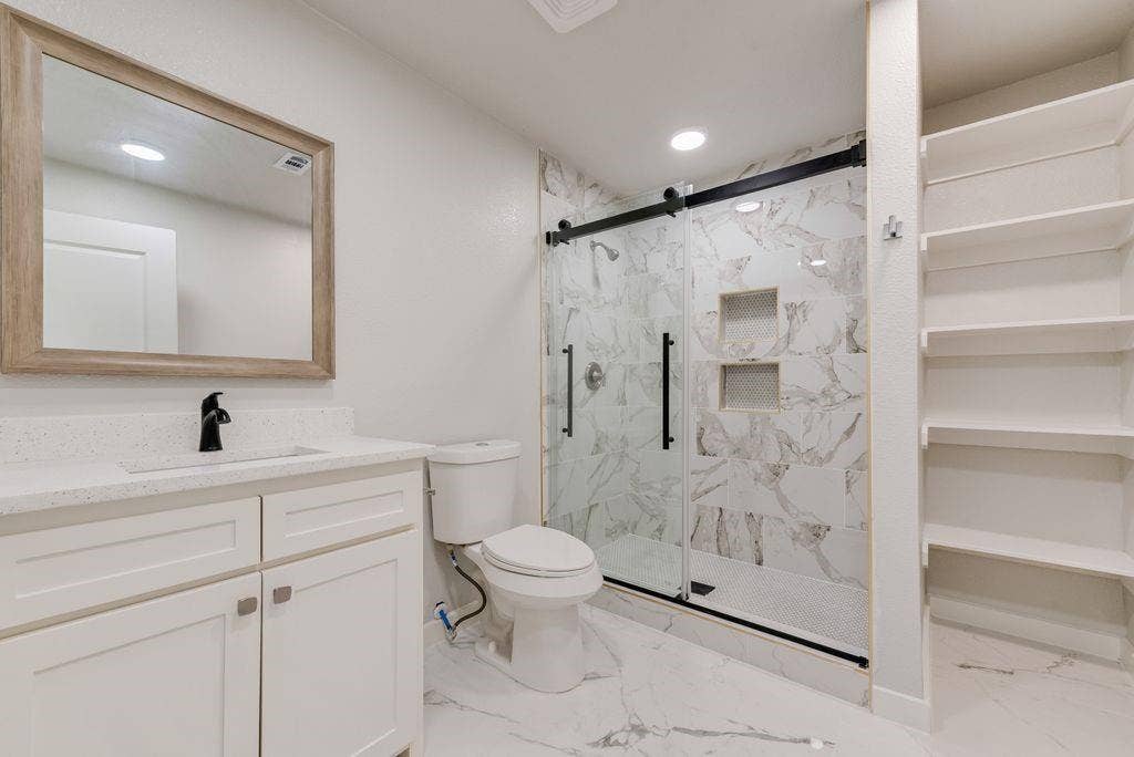 307 N 4th Street, Crandall, TX 75114 White vanity with a quartz countertop and integrated sink