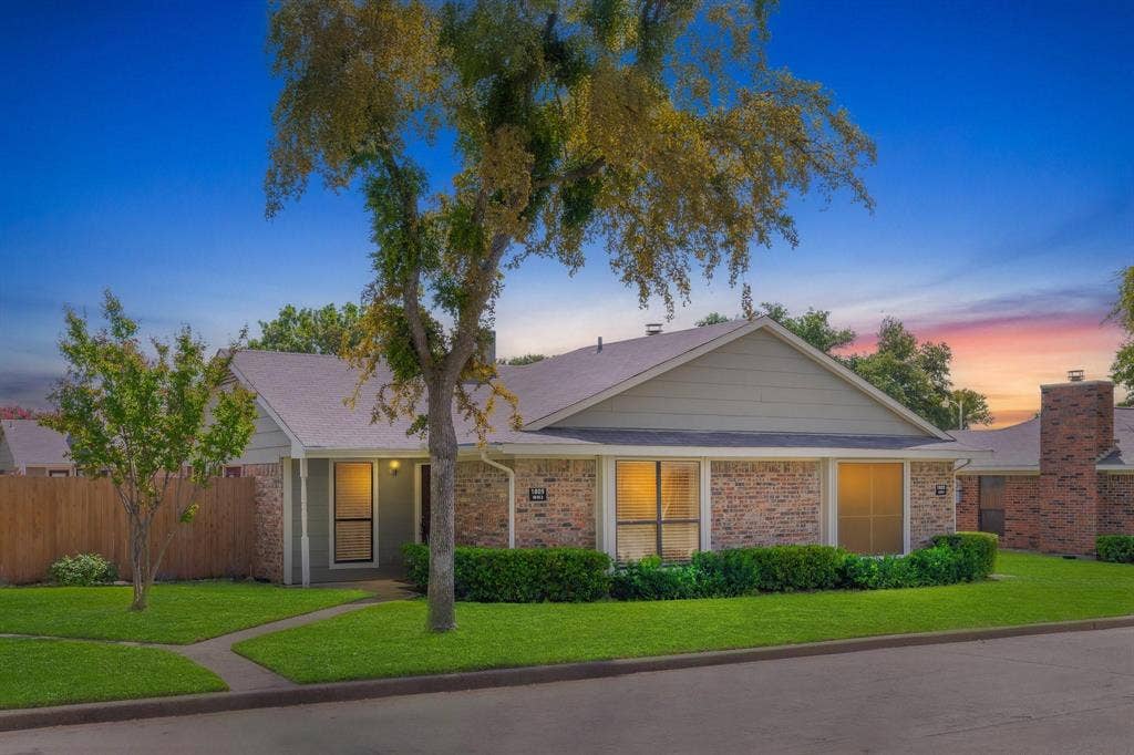1805 W Spring Creek Parkway, #MM2, Plano, TX 75023 Brick and siding exterior with a gabled roof