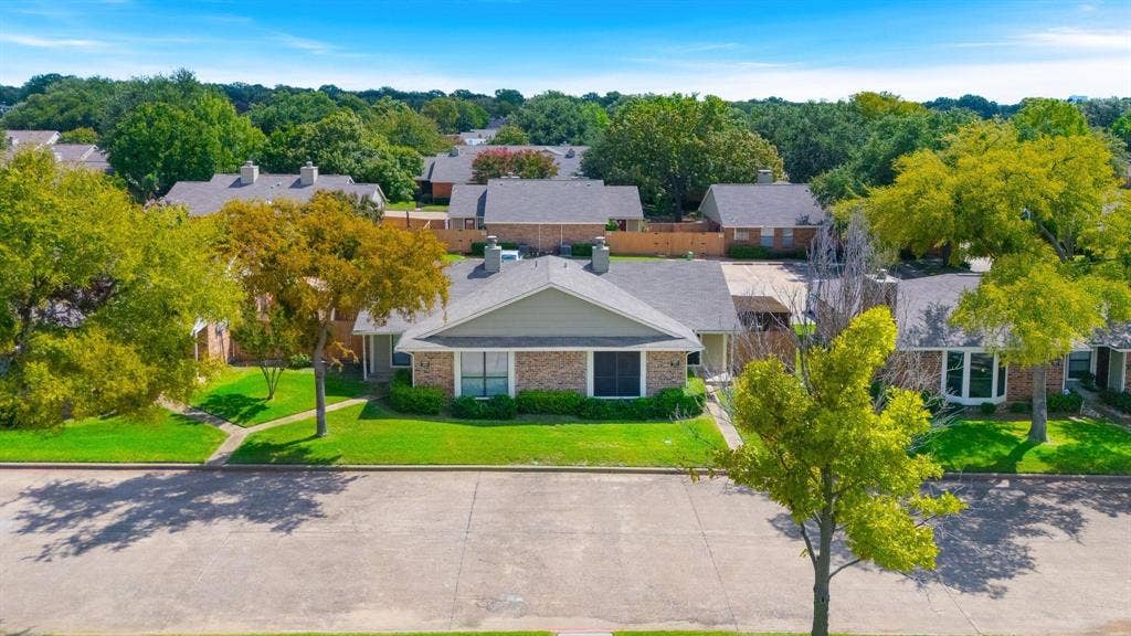 1805 W Spring Creek Parkway, #MM2, Plano, TX 75023 Brick and siding exterior with a gabled roof