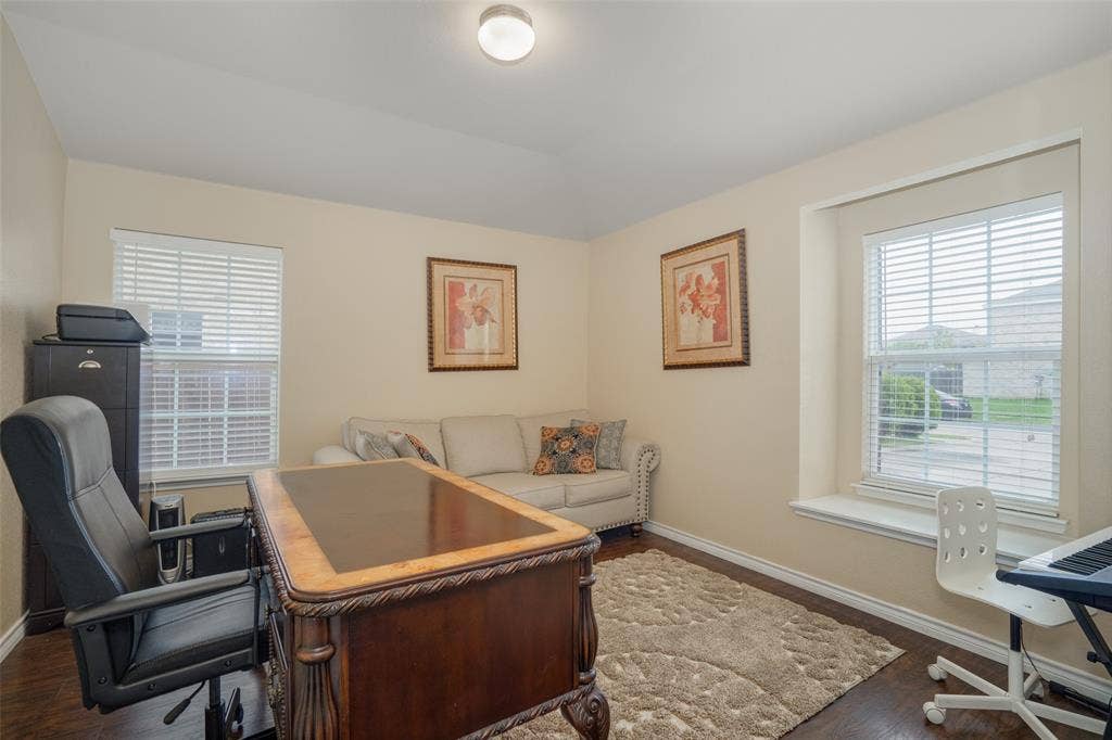2035 Matagorda Lane, Grand Prairie, TX 75052 Recessed lighting, wood-finish flooring, and multiple windows with blinds