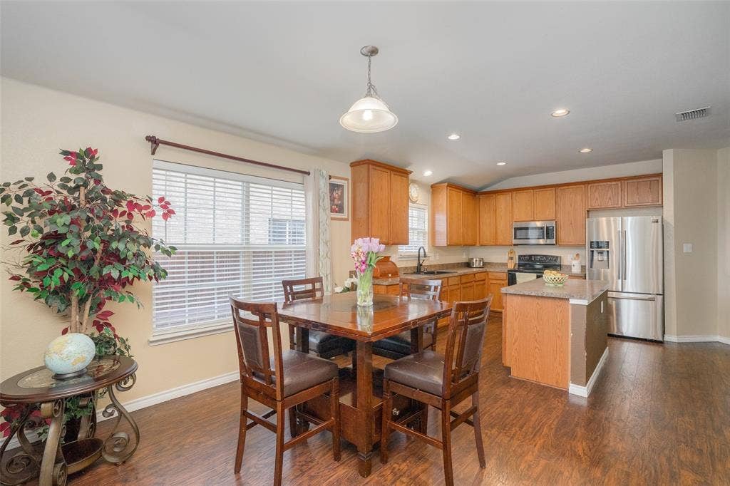 2035 Matagorda Lane, Grand Prairie, TX 75052 Kitchen featuring wood-finish flooring, recessed lighting, wood cabinetry, and stainless steel appliances