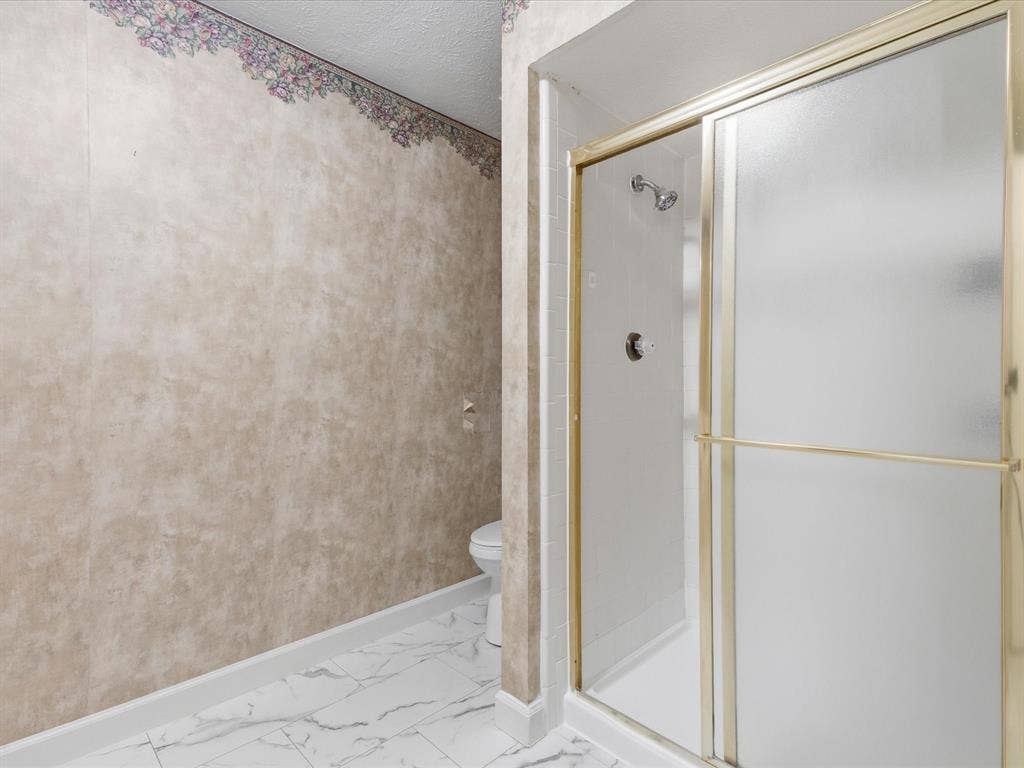 7612 Jerome Drive, Plano, TX 75025 White tile flooring with grey veining