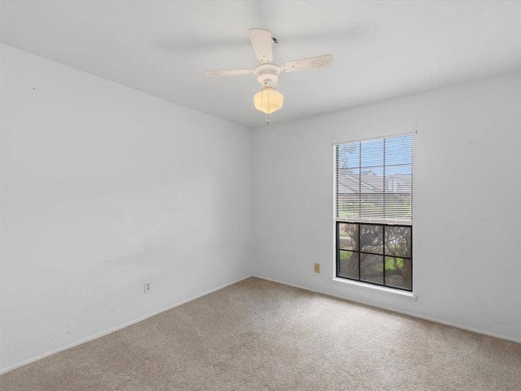 7612 Jerome Drive, Plano, TX 75025 Neutral carpet flooring, white walls, and a ceiling fan with integrated lighting