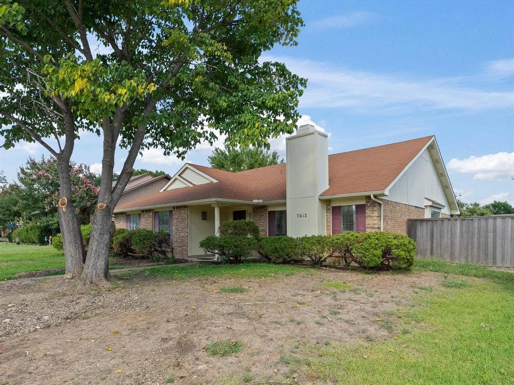 7612 Jerome Drive, Plano, TX 75025 Brick exterior featuring a gabled roof and a prominent chimney