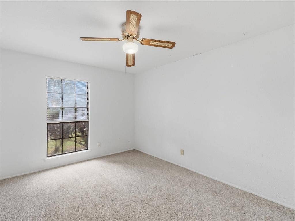 7612 Jerome Drive, Plano, TX 75025 Recessed window, ceiling fan with integrated lighting, and neutral carpeting