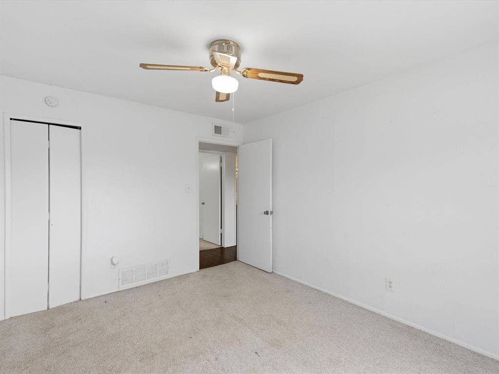 7612 Jerome Drive, Plano, TX 75025 Neutral wall color, ceiling fan with integrated lighting, bi-fold closet doors, and light-toned carpeting