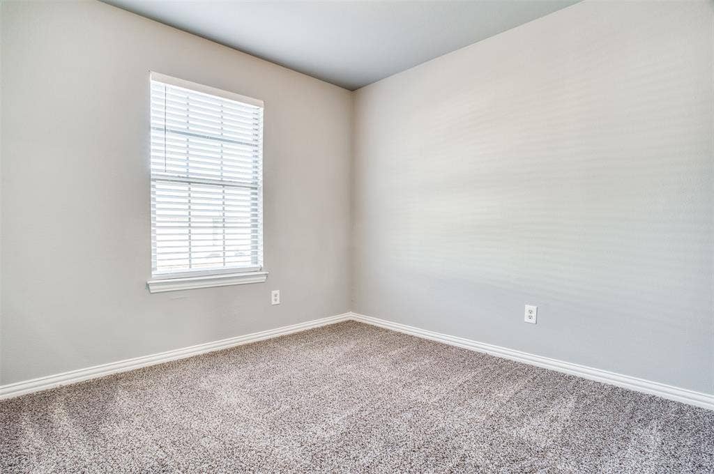 2364 Calendar Court, Grand Prairie, TX 75050 Recessed window with horizontal blinds, light gray wall paint, and gray textured carpet