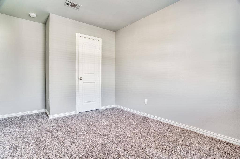 2364 Calendar Court, Grand Prairie, TX 75050 Plush carpet flooring, light-toned wall paint, recessed ceiling light, white trim, and a paneled door