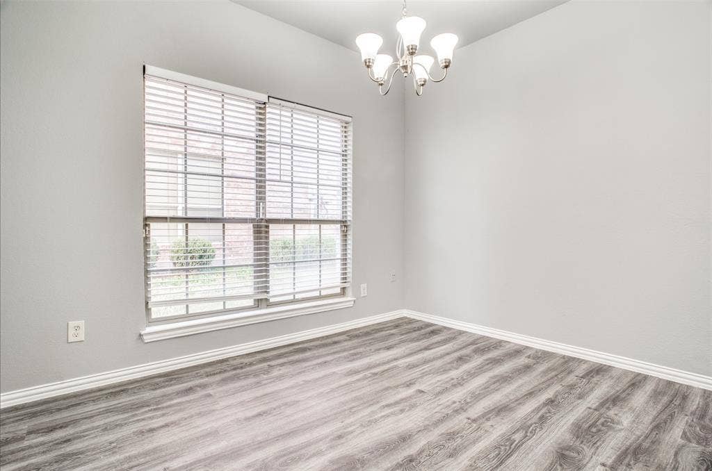 2364 Calendar Court, Grand Prairie, TX 75050 Recessed lighting, wood-finish flooring, white trim, and a multi-bulb ceiling fixture