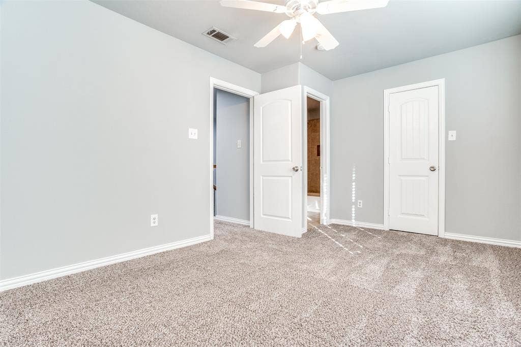 2364 Calendar Court, Grand Prairie, TX 75050 Plush carpeting, light gray wall finish, crisp white trim, and a ceiling fan