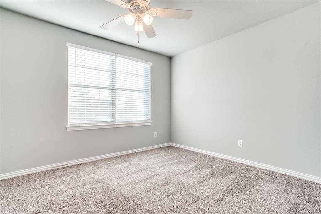 2364 Calendar Court, Grand Prairie, TX 75050 Wall-to-wall carpeting, overhead ceiling fan with lighting, window with blinds, and light-toned wall paint