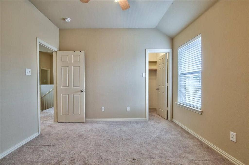 7108 Jessup Court, Plano, TX 75074 Carpeted room with vaulted ceilings and a ceiling fan