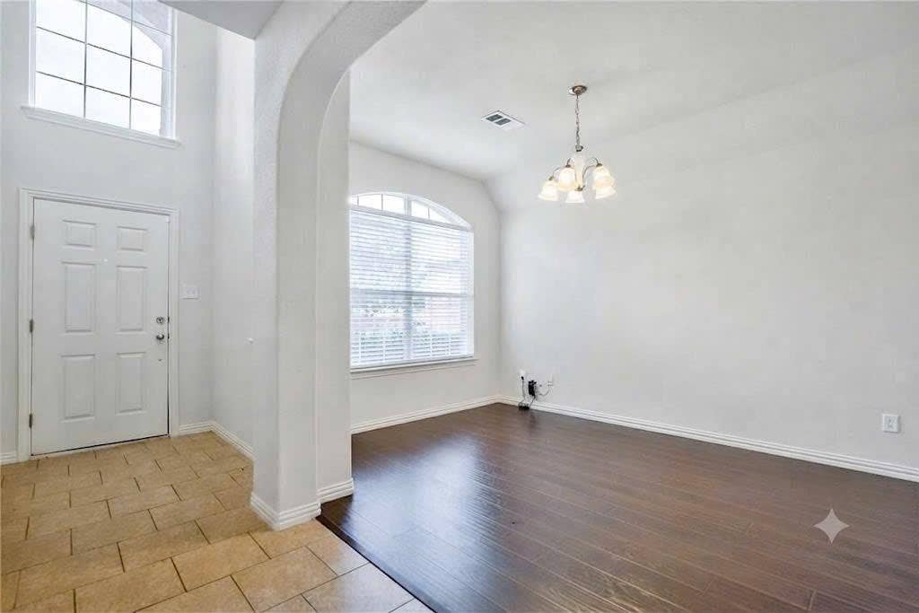 7108 Jessup Court, Plano, TX 75074 Two-story entry with arched window, decorative front door, and tile flooring