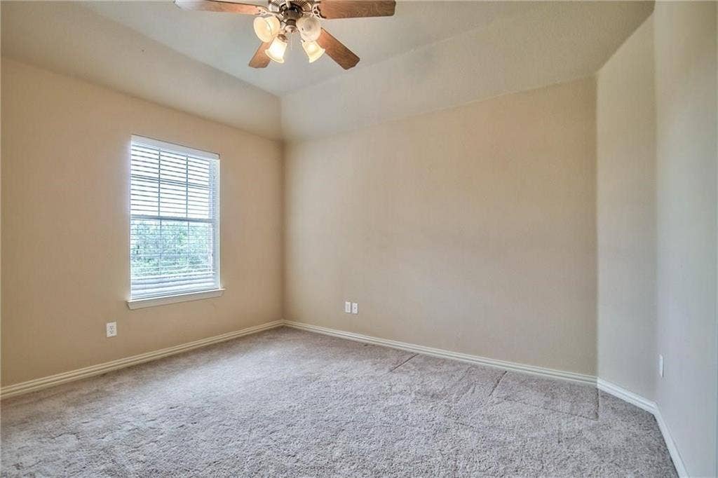 7108 Jessup Court, Plano, TX 75074 Neutral-toned walls complement the carpeted flooring