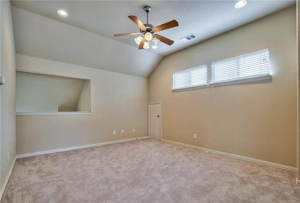 7108 Jessup Court, Plano, TX 75074 Vaulted ceiling with recessed lighting and a ceiling fan