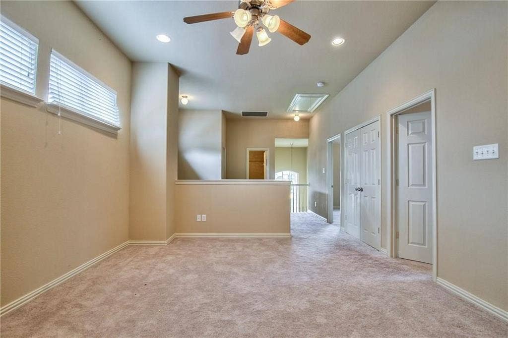 7108 Jessup Court, Plano, TX 75074 Carpeted flooring, recessed lighting, ceiling fan, multiple windows with blinds, and white interior doors
