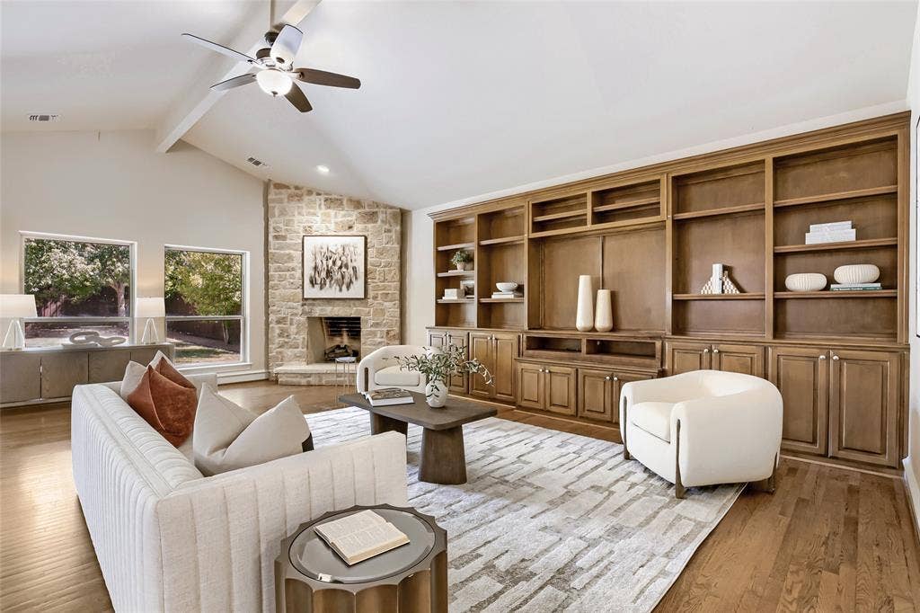 6335 Vanderbilt Avenue, Dallas, TX 75214 Wall of built in cabinets and Austin stone wood burning fireplace with gas logs.