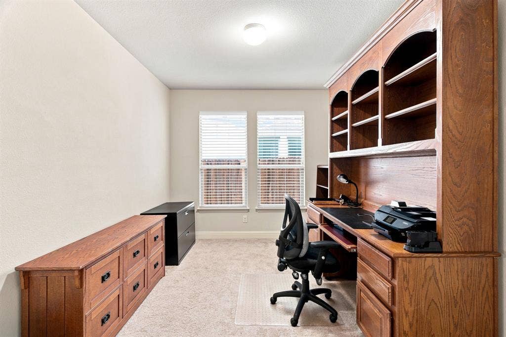 Built-in wooden cabinetry with multiple storage drawers and shelving
