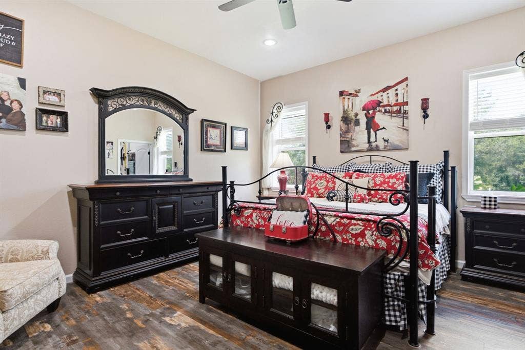 12842 Farm to Market 838, Overton, TX 75684 Wood-finish flooring, ceiling fan, and multiple windows with blinds