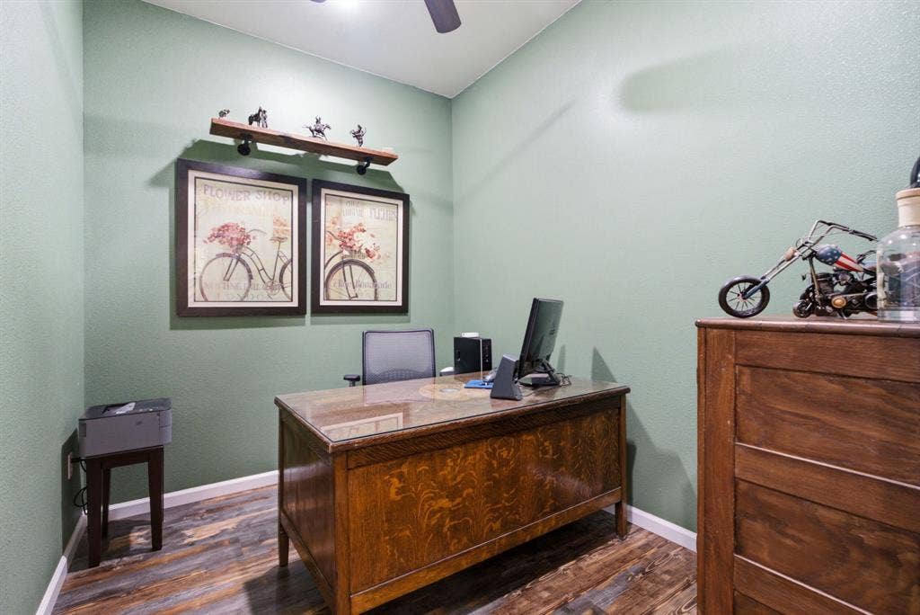 12842 Farm to Market 838, Overton, TX 75684 Wood-finish flooring with light green wall color