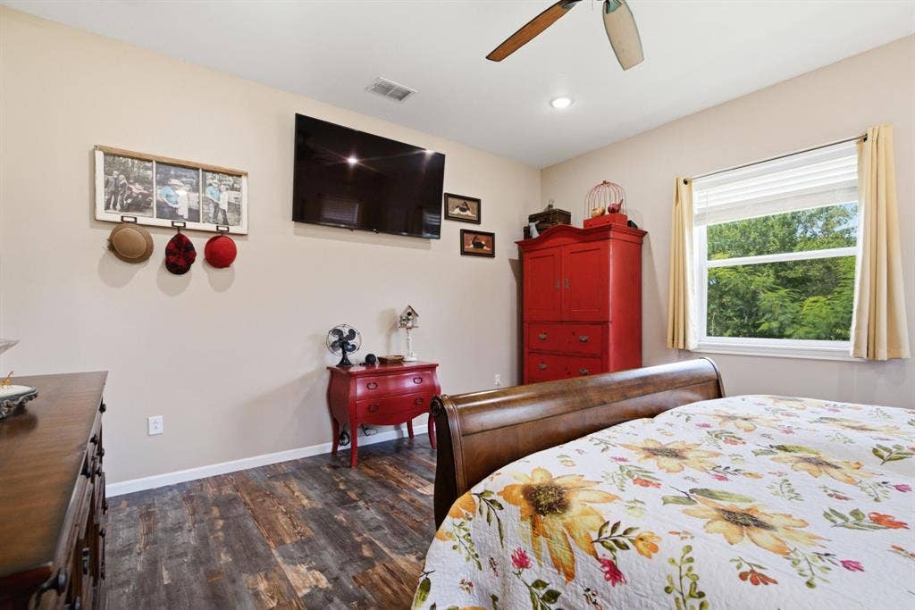 12842 Farm to Market 838, Overton, TX 75684 Wood-finish flooring, ceiling fan, recessed lighting, and a single window with blinds