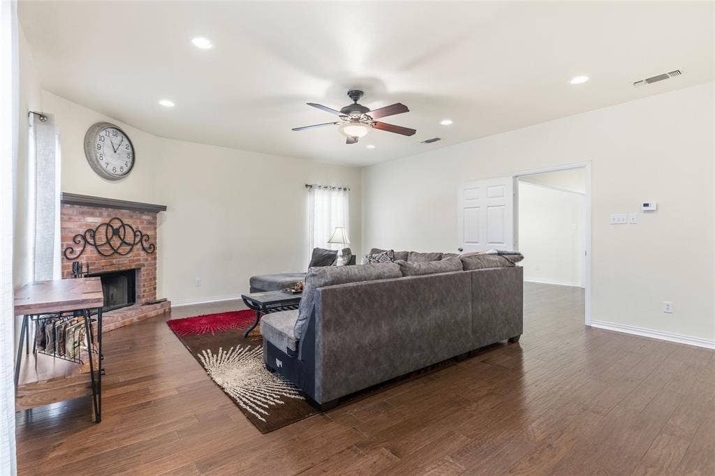 1308 Madeline Street, Commerce, TX 75428 Beautiful wood burning fireplace as the focal point