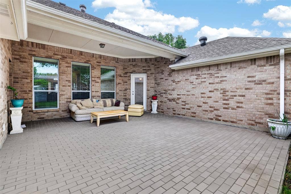 3002 Silver Springs Way, Rowlett, TX 75089 Cover Patio, Tile Flooring.