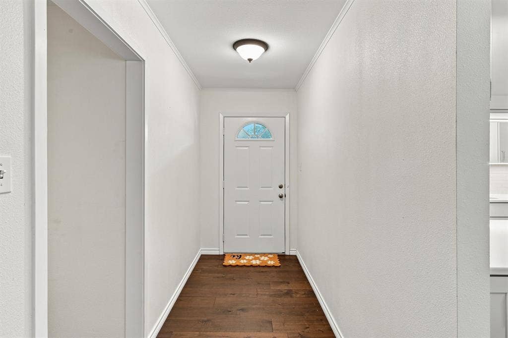 21121 County Road 1291, Flint, TX 75762 Foyer featuring wood-finish flooring, white walls, and a semi-flush mount ceiling light