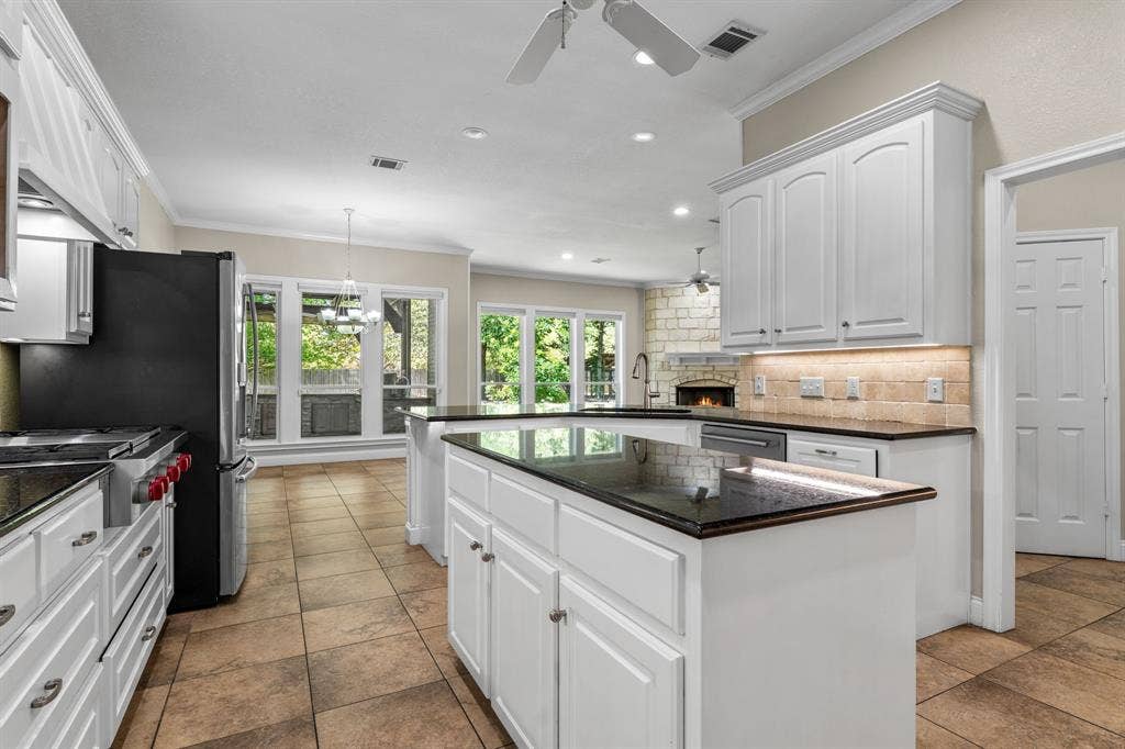 367 Elm Grove Circle, Waco, TX 76657 White cabinetry with dark countertops, stainless steel appliances, tile flooring, and recessed lighting