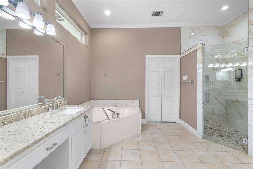 367 Elm Grove Circle, Waco, TX 76657 Dual vanity with integrated sinks, granite countertop, and chrome fixtures