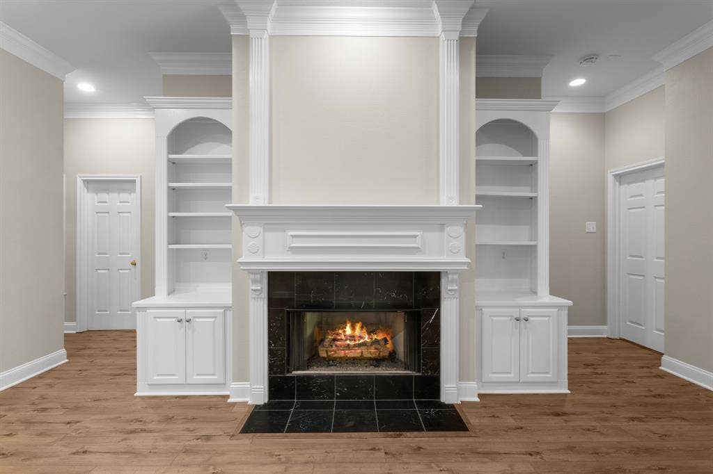 367 Elm Grove Circle, Waco, TX 76657 Fireplace featuring a black stone surround and hearth