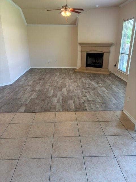 1111 Whitaker Way, Glenn Heights, TX 75154 Vaulted ceiling, ceiling fan, fireplace with mantel, window with blinds, and wood-finish flooring