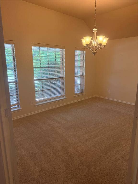 1111 Whitaker Way, Glenn Heights, TX 75154 Vaulted ceiling, multiple windows with blinds, five-light chandelier, and wall-to-wall carpeting