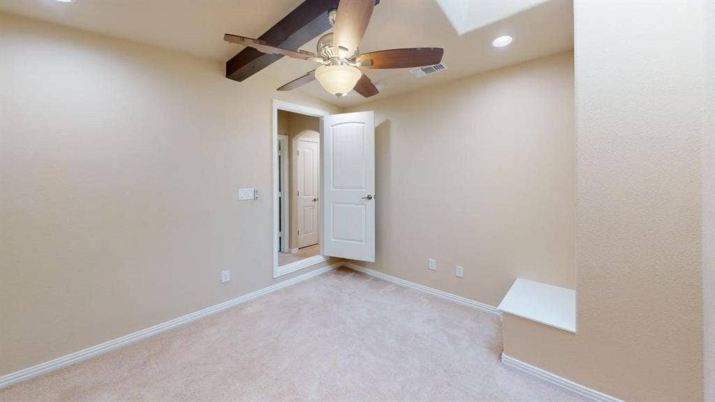 Wall-to-wall carpeting, recessed lighting, and a ceiling fan with integrated light