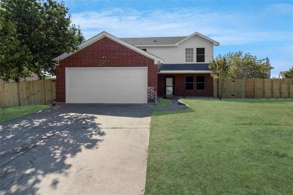 408 Centennial Place, Crowley, TX 76036 Brick and siding exterior with a two-car garage, concrete driveway, and a front lawn