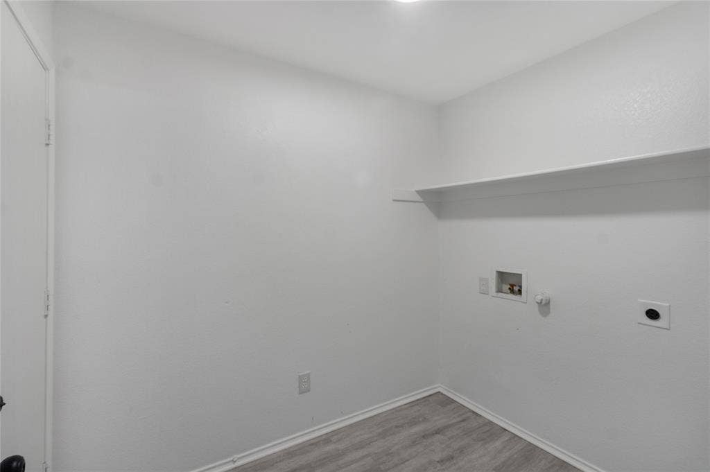 408 Centennial Place, Crowley, TX 76036 Built-in shelving, white walls, and wood-finish flooring