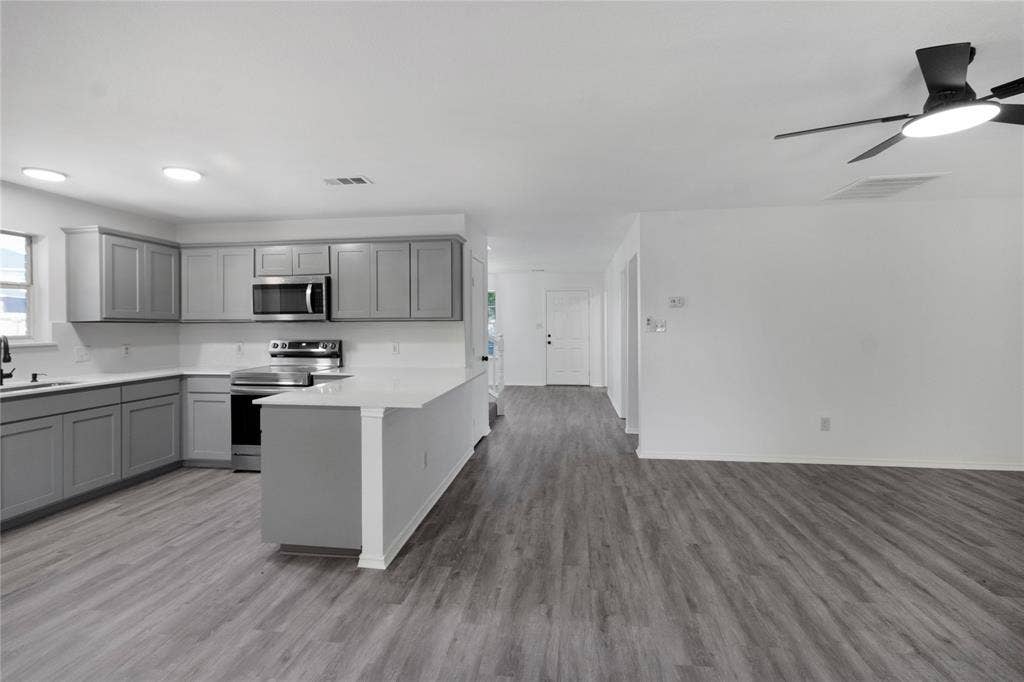 408 Centennial Place, Crowley, TX 76036 Open-concept living space with wood-finish flooring, recessed lighting, and a ceiling fan