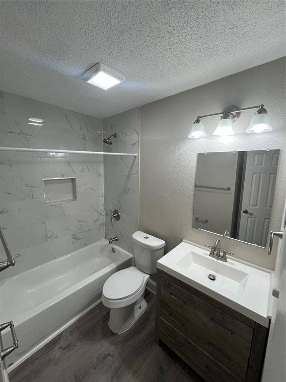 820 E Edith Street, Irving, TX 75061 Full bathroom featuring a single vanity with storage, integrated sink, and wood-finish cabinetry