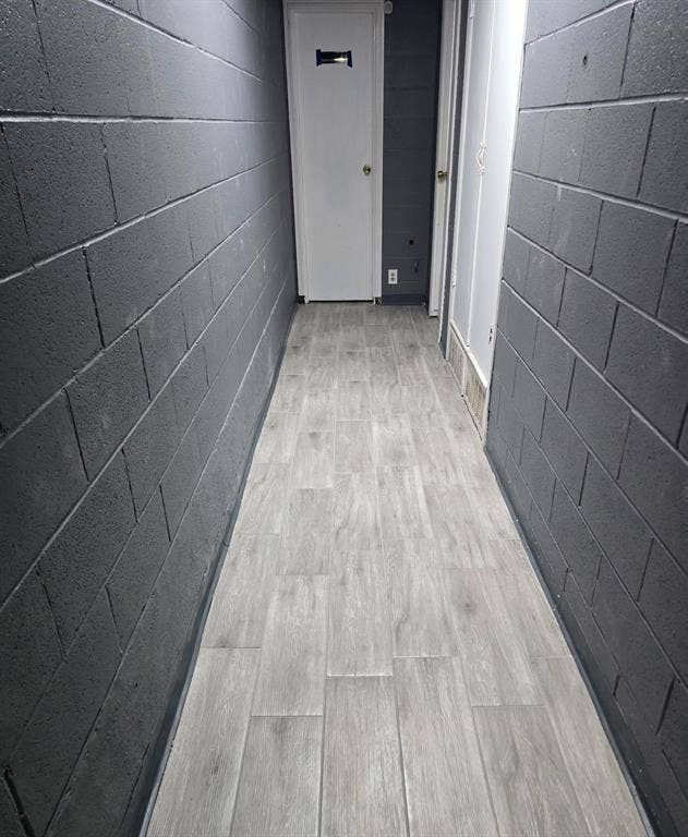 4309 Action Street, Garland, TX 75042 Wood-finish flooring with a block wall texture